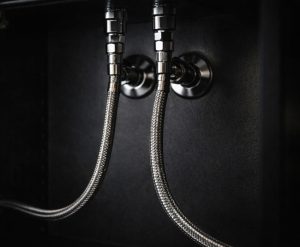 braided supply hose connection under sink