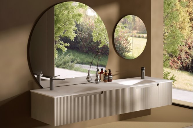 Modern white bathroom vanity with marble countertop.