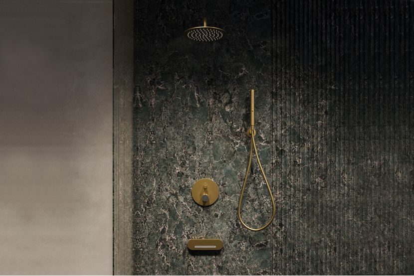 Modern shower with gold fixtures on dark green marble