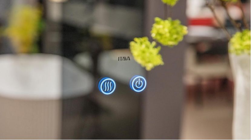Smart touch sensor on an anti-fog LED bathroom mirror