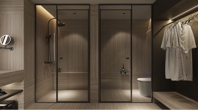 Luxury hotel bathroom featuring a matte black wall-mounted rain shower system